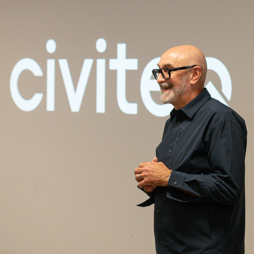 Man standing in front of Civiteq logo