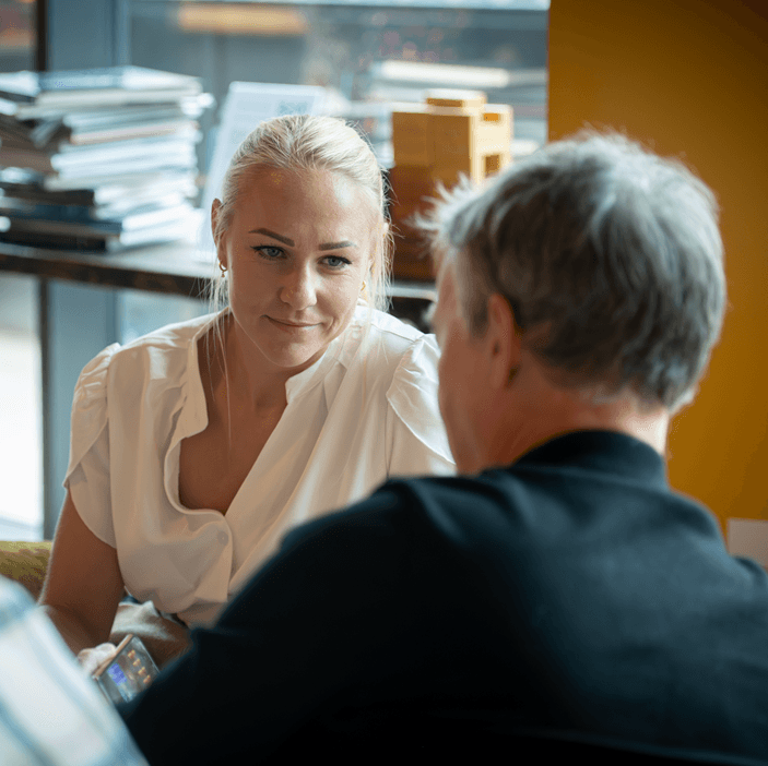 Woman sat talking to a man